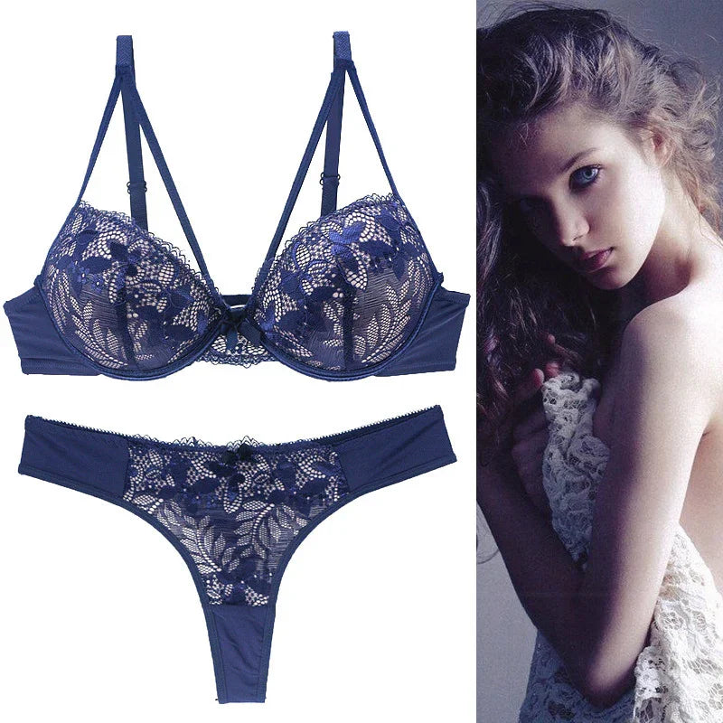 Navy blue lace bra and panty set for women, featuring floral patterns and soft, breathable fabric.