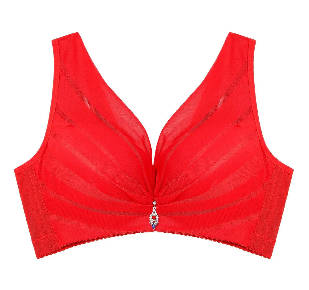 Red wireless bra with soft, breathable fabric and decorative jewel accent, designed for comfort and support.